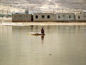 A man sits on a rock in a flooded street following heavy rain in the city of Amran, 50 kms north of Yemen's capital Sanaa on April 15, 2016. (AFP/Mohammed Huwais) A man sits on a rock in a flooded street following heavy rain in the city of Amran, 50 kms north of Yemen's capital Sanaa on April 15, 2016. (AFP/Mohammed Huwais)