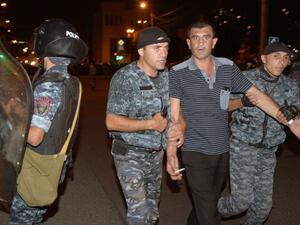 Armenian police detain opposition supporters blocking a street leading to Erebuni police station seized by gunmen - supporters of fringe jailed opposition leader Zhirair Sefilyan - in Yerevan late on July 29, 2016. (AFP/Karen Minasyan) Armenian police detain opposition supporters blocking a street leading to Erebuni police station seized by gunmen - supporters of fringe jailed opposition leader Zhirair Sefilyan - in Yerevan late on July 29, 2016. (AFP/Karen Minasyan)