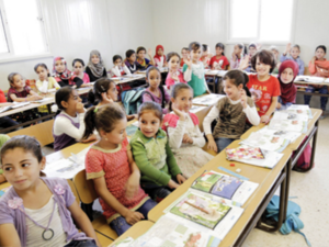 Syrian children sit in a classroom at the Zataari refugee camp. (AFP/File)
