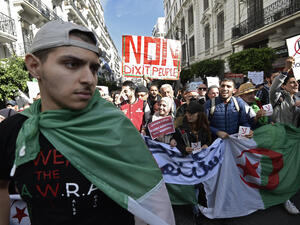 Algerians protest against upcoming elections that they view as a sham. / AFP