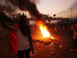 العراق: اشتباكات مسلحة واحتجاجات وحظر تجول حتى إشعار آخر