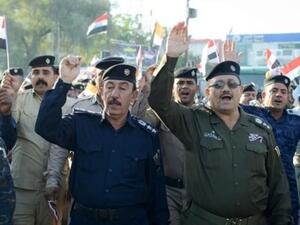 مسيرة لعناصر من قوات الامن في كربلاء