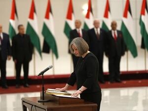 Rola Maayya is sworn in as tourism minister in the new Palestinian government, in the Israeli-occupied West Bank town of Ramallah (AFP)