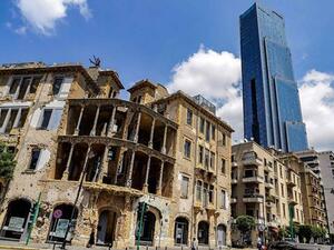 One of Beirut 's iconic landmarks "Sama Beirut" (Beirut Sky) stands tall behind "Beit Beirut" (the house of Beirut) (Twitter)
