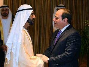 السيسي يلتقي بن راشد في بكين