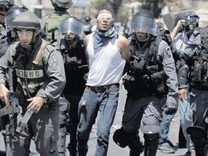 إسرائيل تعتقل 12 فلسطينيا في الضفة الغربية