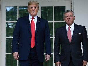 Jordan’s King Abdullah II (R) is greeted by US President Donald Trump at the White House on June 25, 2018. (AFP Photo/Brendan Smialowski)