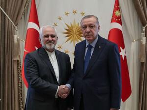 الرئيس التركي رجب طيب أردوغان ووزير الخارجية الإيراني محمد جواد ظريف