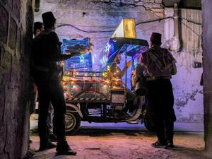 In Pictures: Volunteers and a 'Musaharati' Deliver Pre-Dawn Meals in Syria