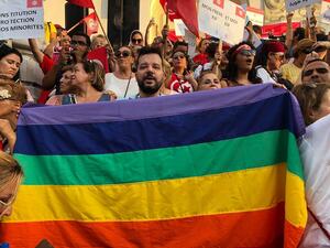 Shams President Mounir Baatour holds a rainbow banner during an August 2018 demonstration in Tunisia. (Facebook/Mounir Baatour)