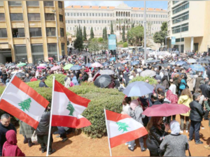 A storm in the making. Public servants during a protest in downtown Beirut against cuts to their salaries, April 17. 