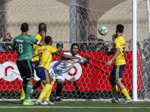 Khadamat Rafah Club's goalkeeper leaps to save the ball during the during the first leg match of the Palestine Cup final between Khadamat Rafah Club and Balata Sports Centre in Rafah in the southern Gaza Strip on June 30, 2019.