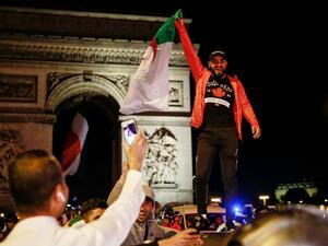 Supporters celebrate after Algeria won the AFCON semi-final match against Nigeria in Paris.