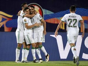Algeria will face either Ivory Coast or Mali in the Africa Cup of Nations last eight after seeing off Guinea in comfortable fashion.