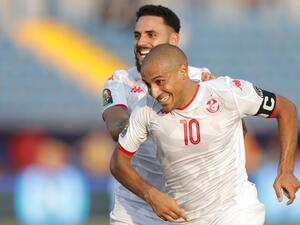  Mouez Hassen made a calamitous mistake against Mali, but Wahbi Khazri's deflected free-kick earned Tunisia a 1-1 draw in Group E. 