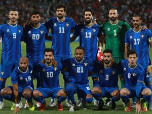 Kuwait's starting eleven pose for a group picture during the World Cup Qatar 2022 Group B qualification football match against Jordan at the Amman International stadium on Oct 10, 2019