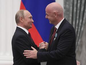 Russian President Vladimir Putin (L) awards the "Order of Friendship" to FIFA President Gianni Infantino during a ceremony at the Kremlin in Moscow