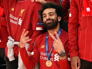 The Reds manager concedes his Egyptian star is desperate to claim the award for a third season running (Photo: AFP)