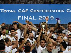 Egypt's Zamalek players celebrate with the trophy after they won the CAF Confederation Cup final football match between Egypt's Zamalek and Morocco's RSB Berkane