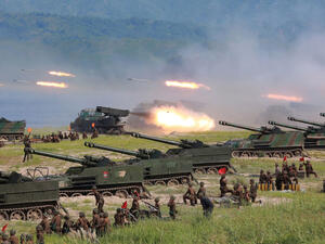 Korean People's Army (KPA) personnel launch missiles during a target strike exercise at an undisclosed location in North Korea. (AFP)