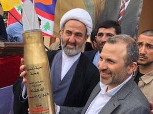 Lebanese FM Jebran Bassil receives a rocket presented to him by Hezbollah. (Twitter)