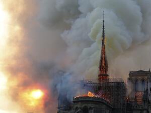 Smoke billow and flames burn from the roof of the landmark Notre-Dame Cathedral in central Paris on April 15, 2019. FRANCOIS GUILLOT / AFP