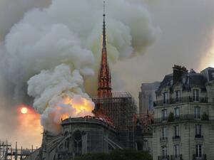 Smoke and flames rise during a fire at the landmark Notre-Dame Cathedral in central Paris on April 15, 2019, potentially involving renovation works being carried out at the site, the fire service said. Geoffroy VAN DER HASSELT / AFP