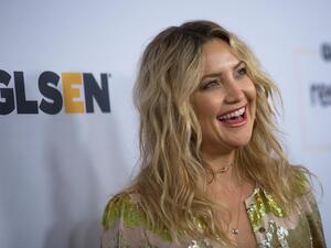 Kate Hudson looks like a ray of sunshine in her golden jumpsuit. (AFP/ File Photo)