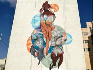 One of Yazan Mesmar’s murals in Amman can be seen. The artist says this painting of three fish was intended to make children stop and think about the artwork (Photo courtesy of Yazan Mesmar)