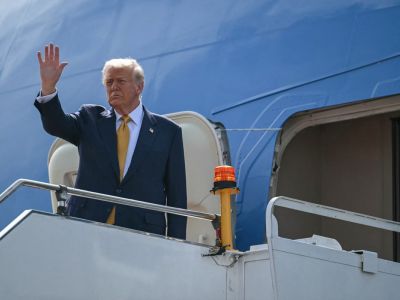 U.S. President Donald Trump waves as he departs on Air Force One from Kuala Lumpur International Airport in Sepang on October 27, 2025. Photo by ANDREW CABALLERO-REYNOLDS / AFP U.S. President Donald Trump