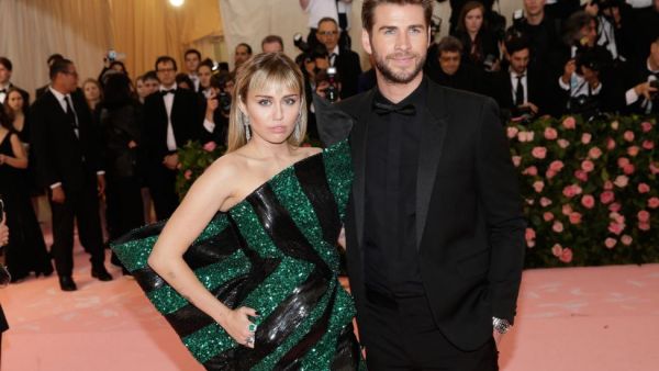 Miley Cyrus L pictured with Liam Hemsworth voiced her love for Hemsworth on their 10 year anniversary as a couple File Photo by John Angelillo UPI License Photo