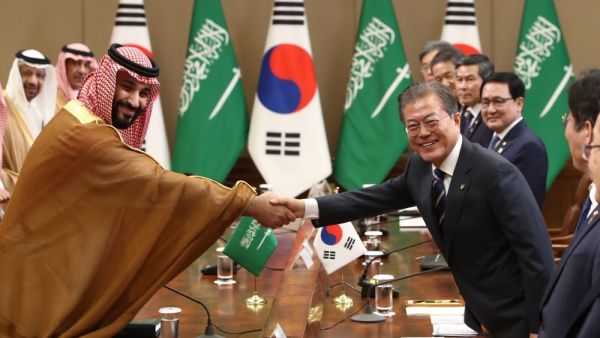 Crown Prince Muhammad Bin Salman, deputy premier and minister of defense, and South Korean President Moon Jae-In shake hands during a meeting at the Presidential Blue House in Seoul on Wednesday.