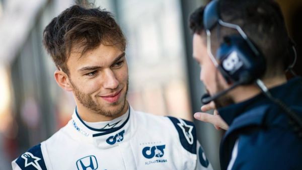 Pierre Gasly of France and Scuderia AlphaTauri talks to his mechanic during the filming day in Misano, Italy on Feb. 15, 2020 (Photo: SG)