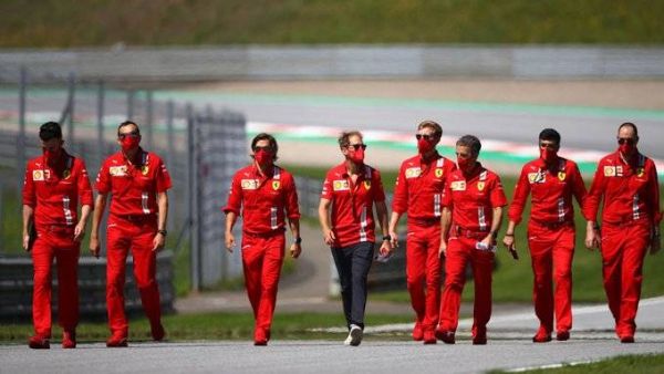 Ferrari's Sebastian Vettel walks the circuit with his team members at the Red Bull Ring in Spielberg, Austria, on Thursday. - Twitter