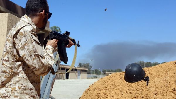 A fighter loyal to the internationally recognised Libyan Government of National Accord (GNA) keeps position near the Salah al-Din military compound, south of the Libyan capital Tripoli, on May 7, 2019. (AFP)