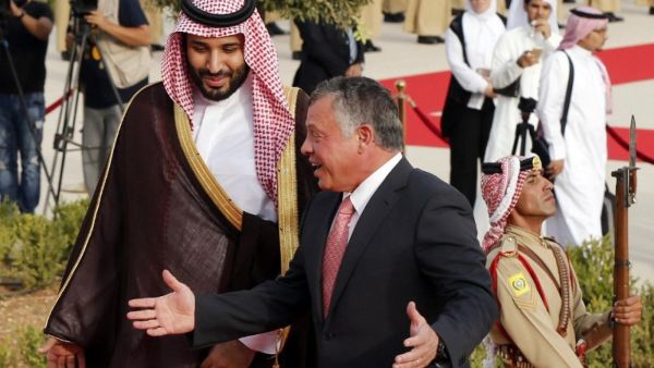 Jordan's King Abdullah (R) welcomes Saudi Arabia's Deputy Crown Prince and Defence Minister Mohammed bin Salman at the Royal Palace in Amman. (AFP)