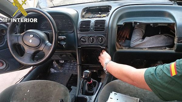 Border police found a man in his twenties squeezed behind a car dashboard. (Daily Mail)