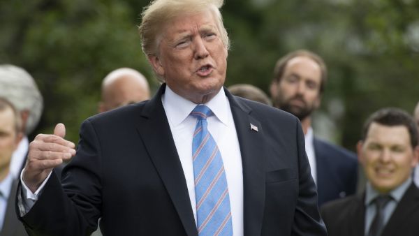 US President Donald Trump gives remarks after receiving a helmet from French race car driver and Indianapolis 500 winner Simon Pagenaud at the White House in Washington, DC, on June 10, 2019. (Jim WATSON / AFP)