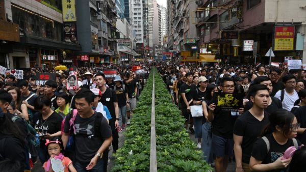 Thousands of protesters dressed in black take part in a new rally against a controversial extradition law proposal in Hong Kong on June 16, 2019. (AFP/ File Photo)