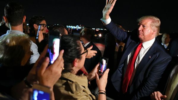 US President Donald Trump meets fans after stepping off Air Force One upon arrival at Miami International Airport in Miami, Florida on June 18, 2019.  (MANDEL NGAN / AFP)