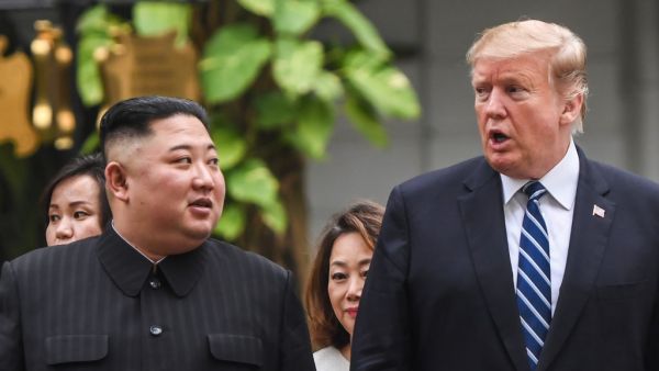 US President Donald Trump (R) walks with North Korea's leader Kim Jong Un during a break in talks at the second US-North Korea summit at the Sofitel Legend Metropole hotel in Hanoi on February 28, 2019. (AFP)