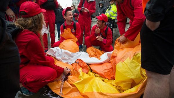 A Tommy Robinson supporter punctured the Baby Trump blimp flying over Parliament Square this afternoon. (Daily Mail)