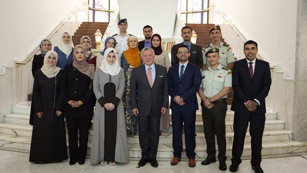King Abdullah II meets with a group of young people he previously met 17 years ago during the first school trip to Raghadan Palace. (Twitter/ @RHCJO)