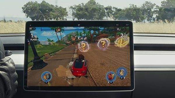 Tesla will launch a new downloadable video game, Beach Buggy Racing 2, Tuesday that will use the actual steering wheel and brake pedal when the vehicle is in park. (Photo from Tesla/Tesa.com)
