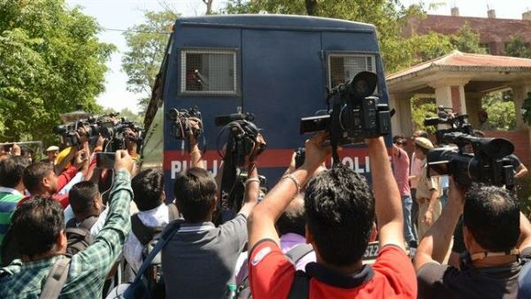 Media gather as a police vehicle carrying seven men accused for the rape and murder of an eight-year-old girl, arrives at a court in Pathankot, in the northern state of Punjab, on June 10, 2019. (AFP/ File Photo)