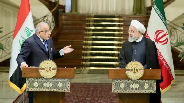 Iranian President Hassan Rouhani, right, and Iraqi Prime Minister Adel Abdul Mahdi speak at news conference in Iranian capital Tehran on Saturday ( AFP)