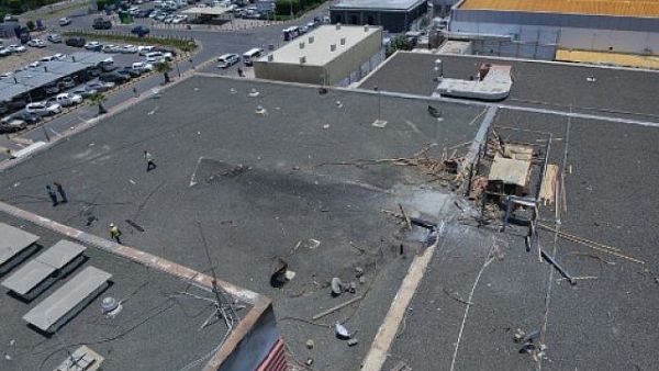the damage on the roof of Abha airport one day after Yemeni rebel missile attack on the civil airport wounded 26 civilians. (Fayez Nureldine / AFP)