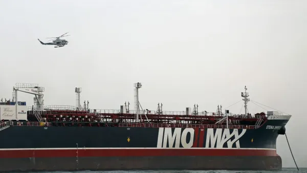 Iranian Revolutionary Guards patrolling around the British-flagged tanker Stena Impero as it's anchored off the Iranian port city of Bandar Abbas  (AFP)