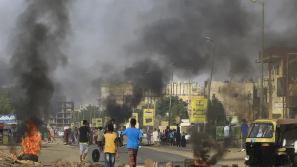 Demonstrators burn tires in the middle of a main street in Khartoum on July 27, 2019, as they protest against the results of the probe into the June raid on a Khartoum protest camp revealed. (AFP/ File Photo)