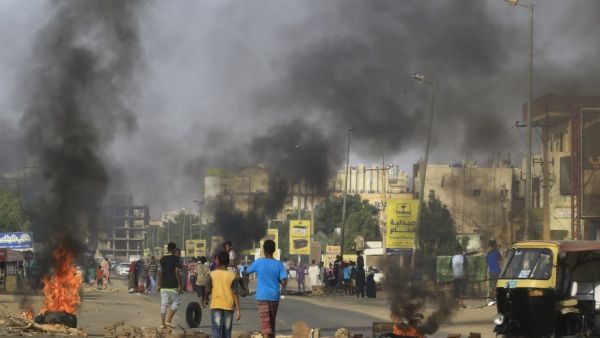 Demonstrators burn tires in the middle of a main street in Khartoum on July 27, 2019, as they protest against the results of the probe into the June raid on a Khartoum protest camp revealed. (AFP/ File Photo)